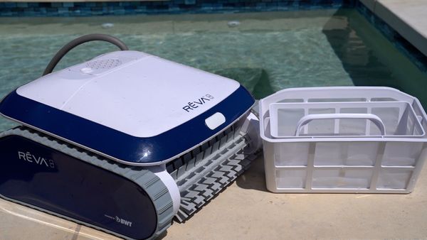 Aquabot REVA next to its filter basket