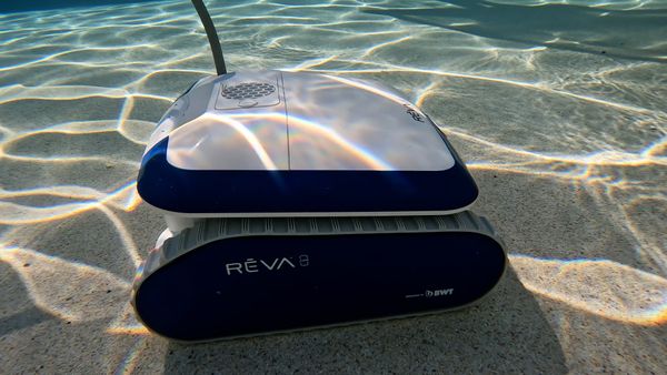 Aquabot REVA on a sunny pool deck