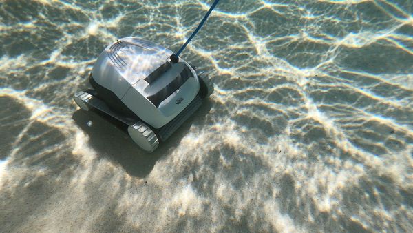 Dolphin E10 in a clean pool with its filter basket