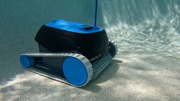 Dolphin Nautilus CC cleaning the pool floor