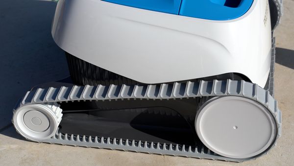Close-up of the Dolphin Proteus DX3's wheel tracks and drive system