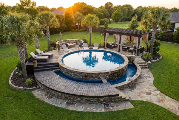 Aerial view of an above-ground pool with a wraparound deck