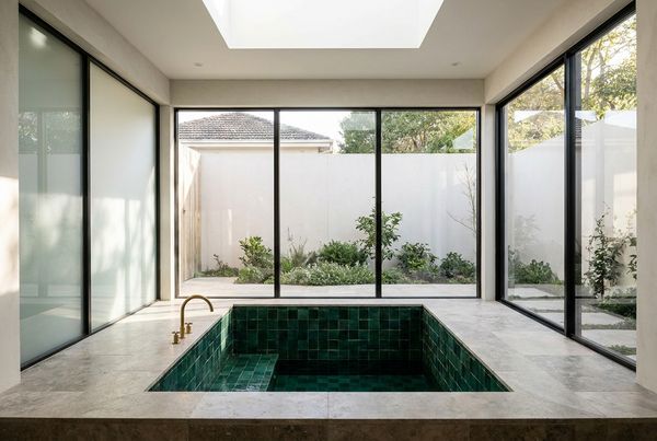 Tiled cold plunge pool with dark interior tile