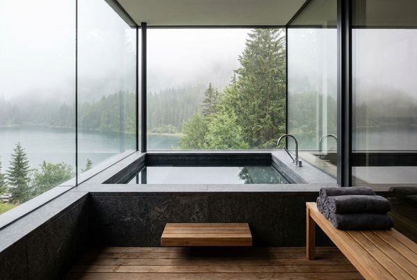 A cast concrete cold plunge built into a patio hardscape