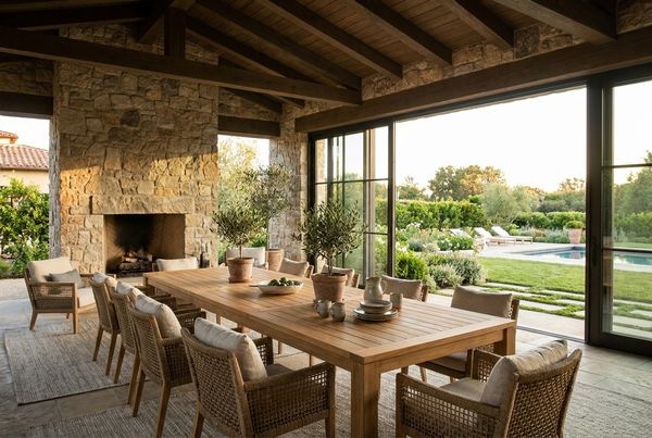 Covered patio set with a dining table and chairs for outdoor meals