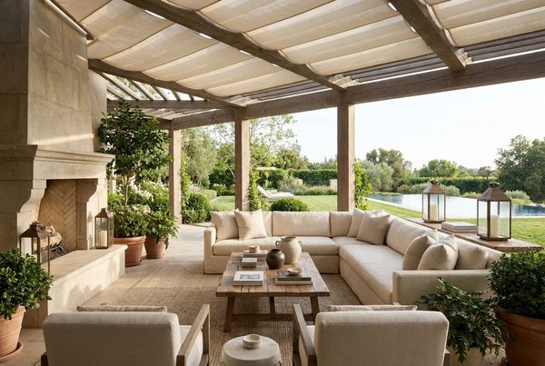 Covered patio lounge with comfortable seating under a solid roof