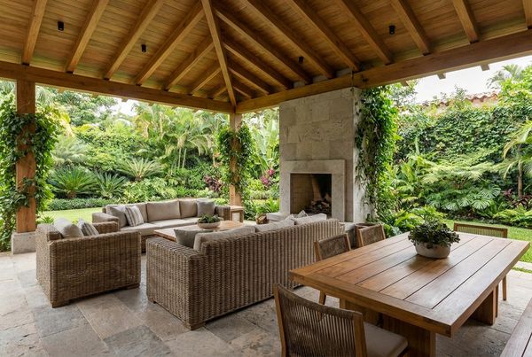 Covered patio with a full outdoor kitchen and bar seating