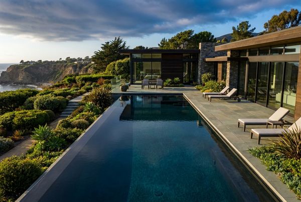 Dark bottom pool with a still, reflective modern surface