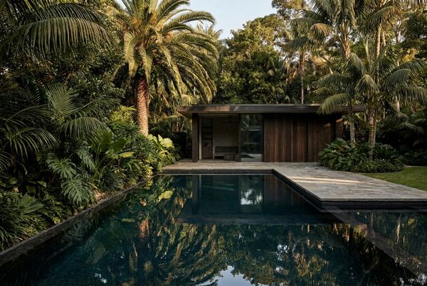 Dark bottom pool with fire bowls along the edge