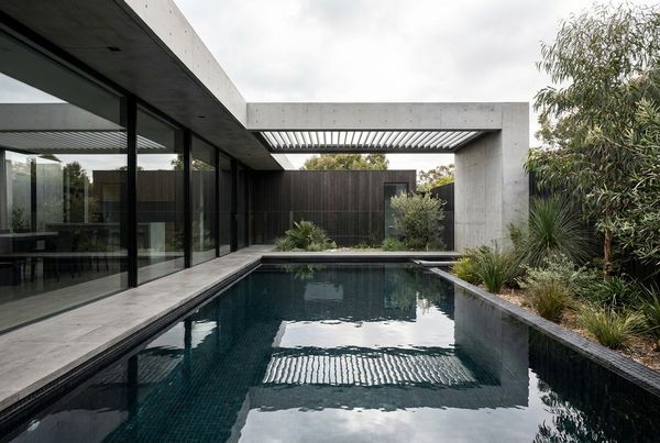 Aerial view of a dark bottom pool in a modern yard
