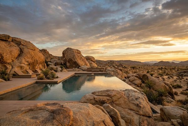 Desert pool framed by large natural boulders