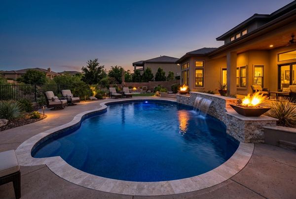 Fiberglass pool with bubblers on a shallow tanning ledge