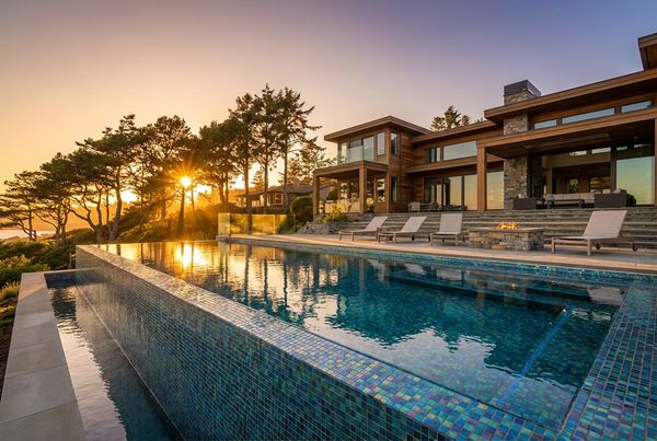 Teal glass tile pool shimmering in bright sun