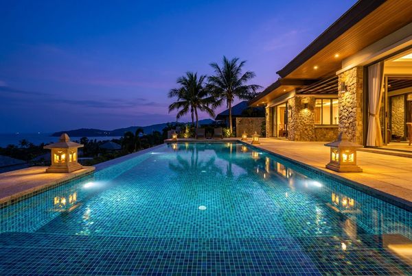 Iridescent glass tile spa raised above a pool