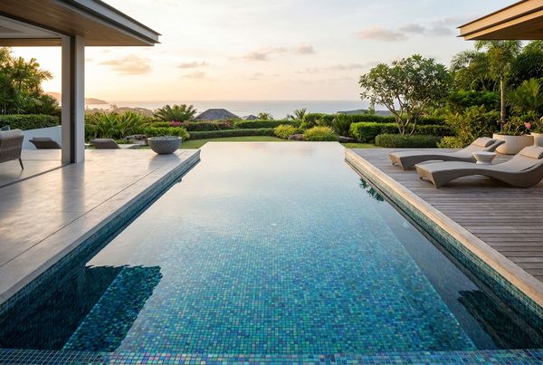 Sunlit glass tile pool with sparkling water