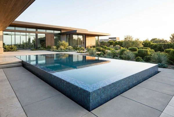 Aerial view of an iridescent glass tile pool