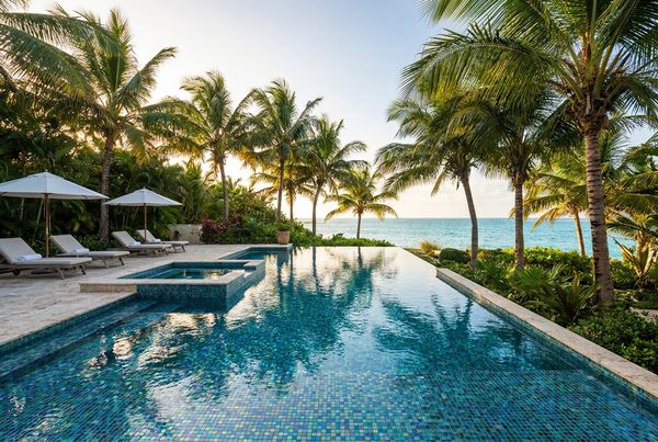 Glass tile infinity pool overlooking a scenic view