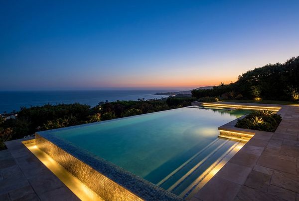 Infinity pool with a raised spa spilling into the main pool