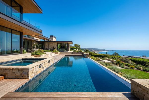 Perimeter-overflow pool with a mirror-flat surface