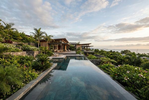Infinity pool set against a mountain range