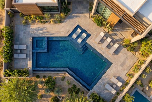 Freeform inground pool with natural stone edging