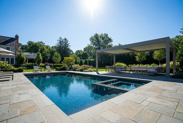 Inground pool with a wide tanning ledge
