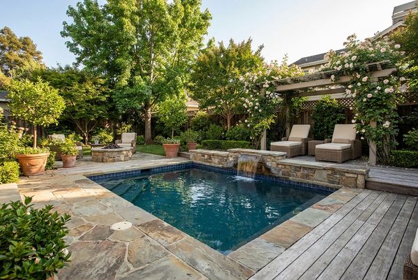 Inground pool with glass tile waterline detail