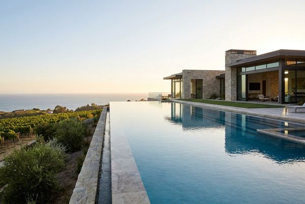 Infinity pool at a hillside estate overlooking a view