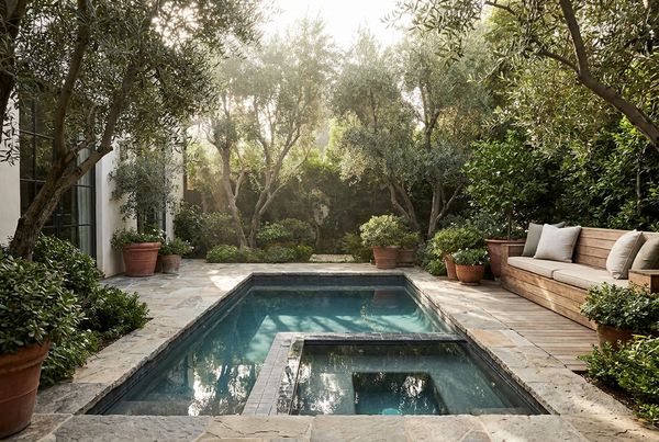 Luxury pool with a sun shelf and lounge chairs