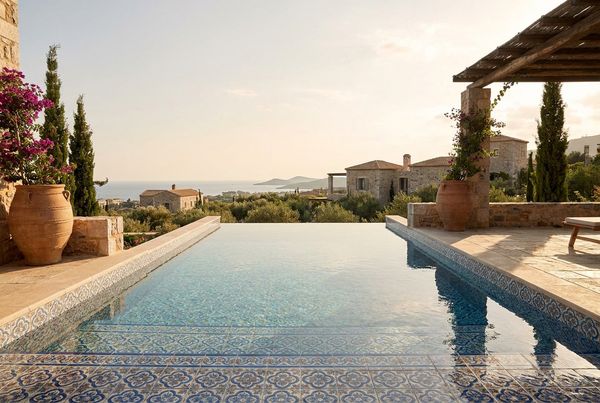 Mediterranean pool trimmed with patterned blue waterline tile