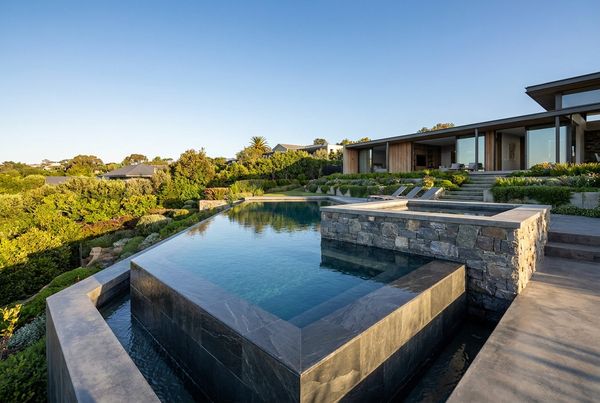 Modern geometric pool with a raised spa on the same axis