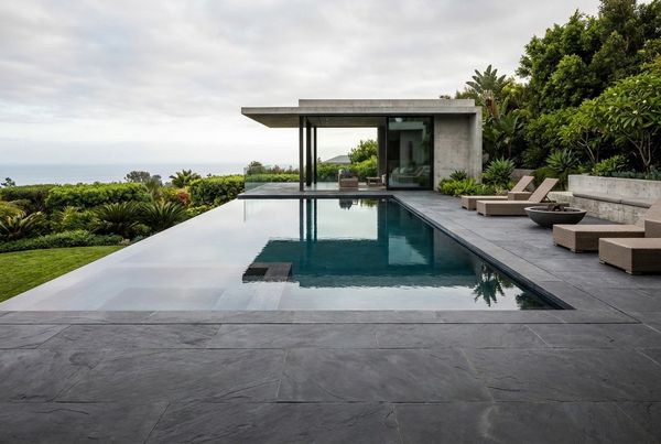 Modern pool with a dark reflective interior finish