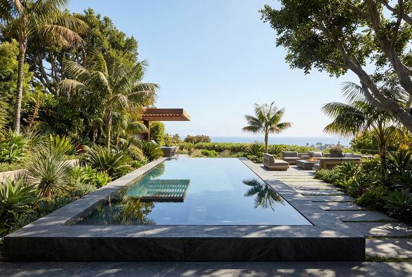 Modern pool with a sheer-descent water feature