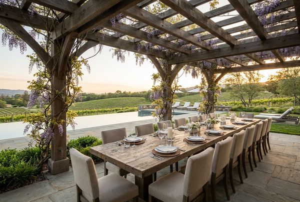 Outdoor dining set arranged under a pergola