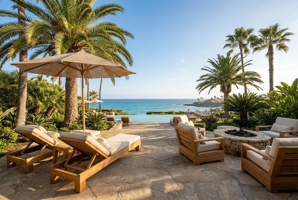 Outdoor patio furniture styled under a shaded pergola