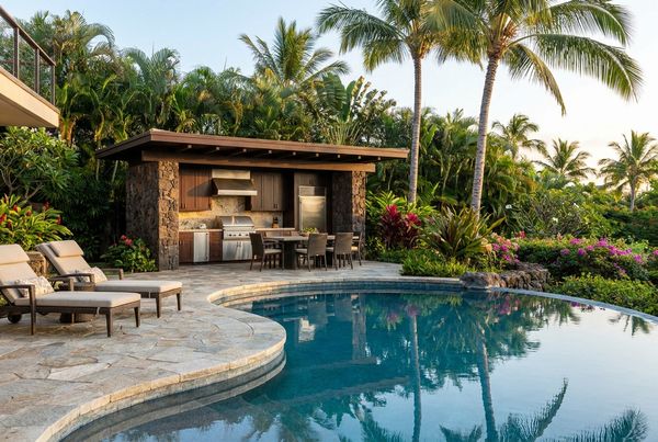 Poolside L-shaped outdoor kitchen with grill and prep zones