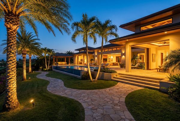 Backyard glowing at twilight with mixed outdoor lighting
