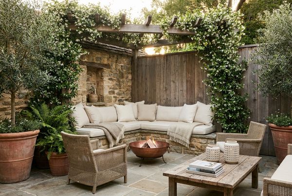Small cozy patio nook with cushioned seating in a corner
