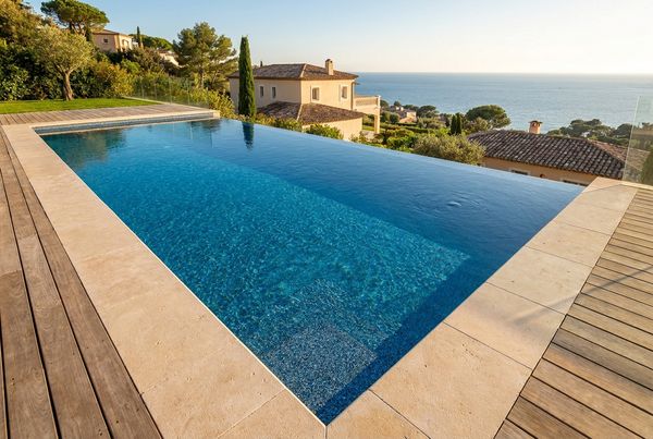 Blue pebble finish pool with bright tropical-looking water