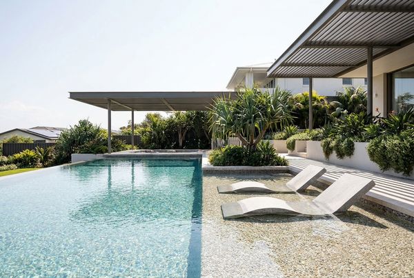 Pebble finish pool with a tanning ledge and shallow sun shelf