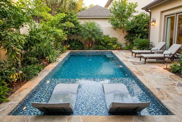 Spillover spa with a matching pebble interior finish