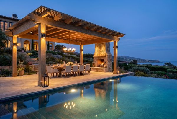 Pergola with a dining set lit for an evening meal