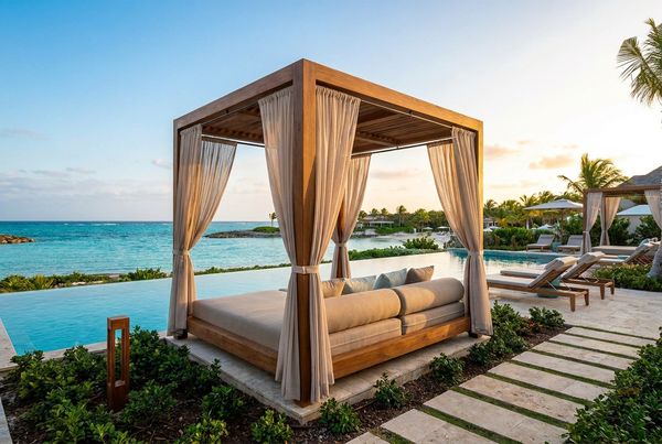 Resort-style pergola with a curtained daybed by the water