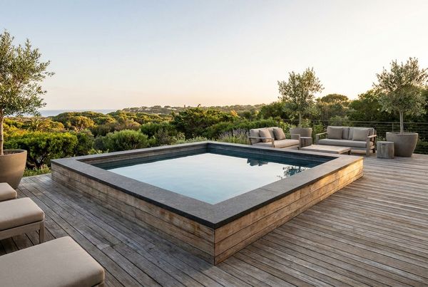 Plunge pool set into a raised wood deck with flush coping