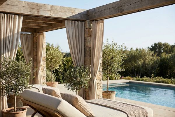 Poolside cabana with a TV and comfortable seating for game days