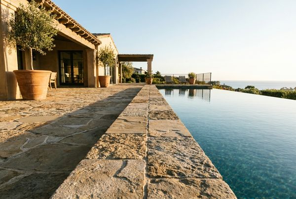 Natural stone pool coping with characterful grey tones