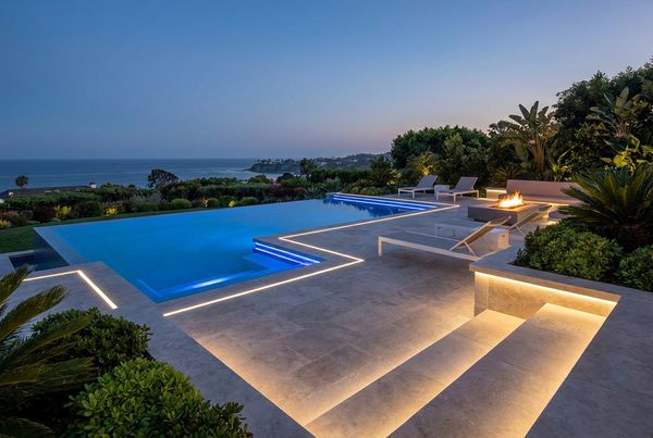 Swimming pool deck with stamped concrete in a stone pattern
