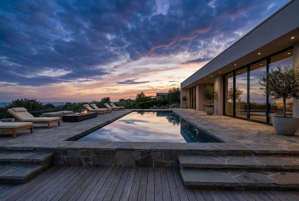 Swimming pool deck with a shade pergola and lounge seating