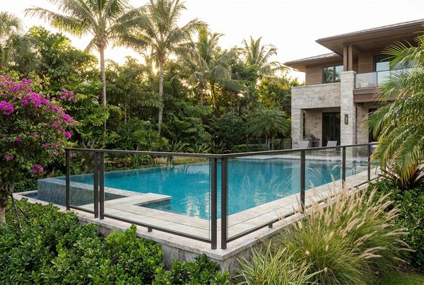 Horizontal-slat pool fence doubling as a privacy screen