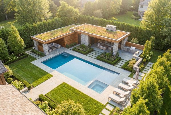 Craftsman-style pool house with timber detailing and a gable roof